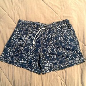 Brand new ModLi swim shorts! 4” navy board shorts w/ white flowers & pockets, XL